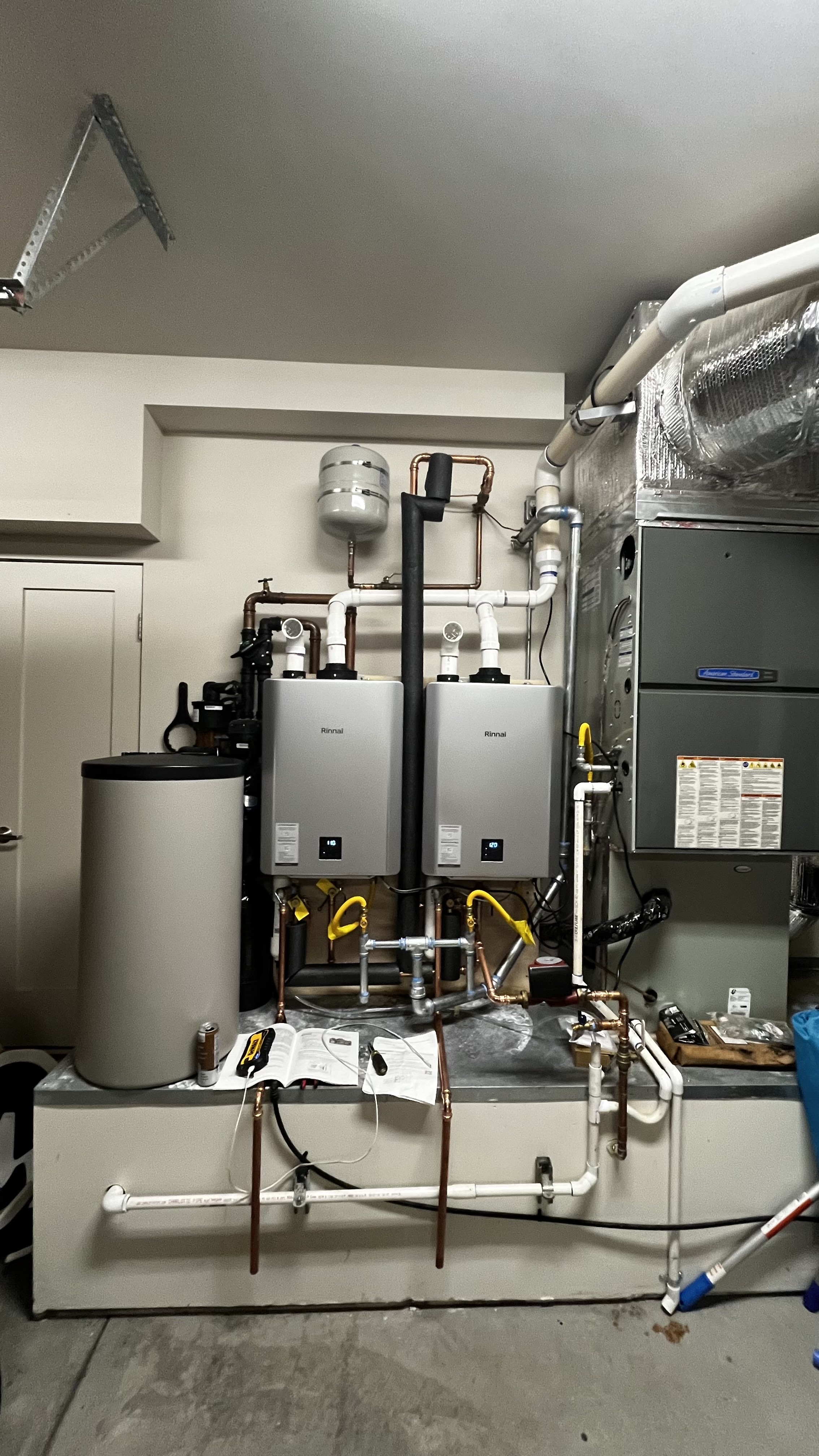 Technician reading an error code on a tankless water heater 